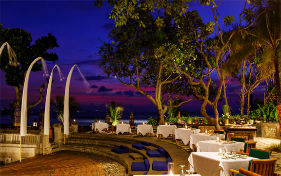 Sunset view of an outside restaurant serving buffet at the Oberoi Resort and Spa, Seminyak, Bali