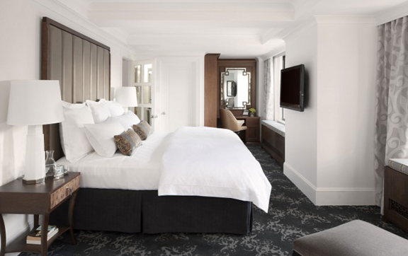 A photograph showing the bed and bedroom of a salon at The Surrey, New York USA