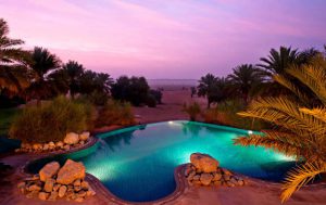 A photograph of one of the private pools at sunset guest can enjoy at Al Maha Dubai.
